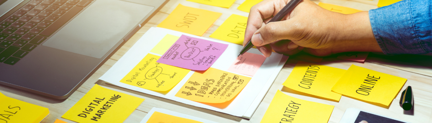 girl sitting in front of digital marketing sticky notes